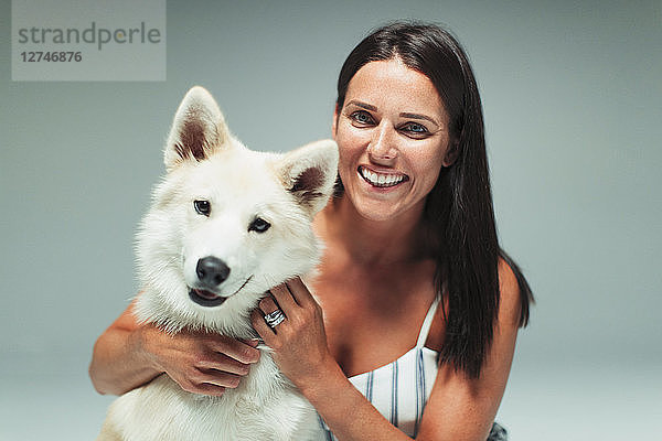 Portrait smiling woman with dog