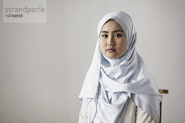 Portrait confident  serious young woman wearing hijab