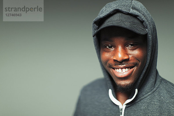 Portrait smiling  confident teenage boy in hoody