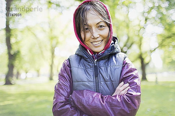 Portrait smiling  confident active senior woman in park