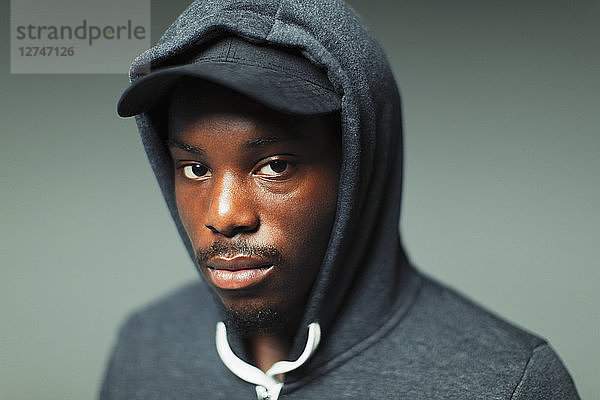 Portrait confident  cool teenage boy in hoody