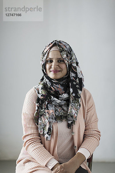 Portrait smiling  confident woman wearing floral hijab