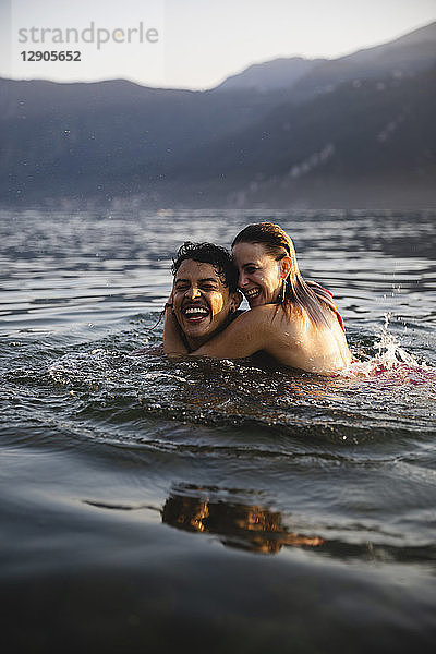 Happy carefree young couple in a lake