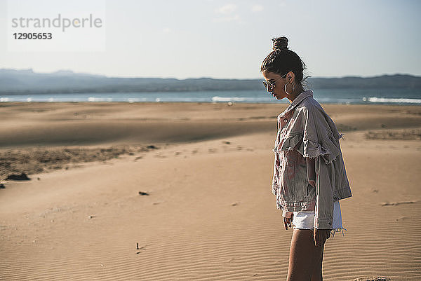 Fashinoable teenage girl on the beach