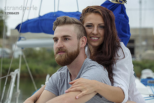 Portrait of a happy couple on a sailing boat
