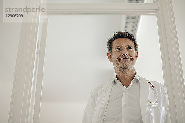 Doctor standing in hospital with stethoscope around neck  portrait