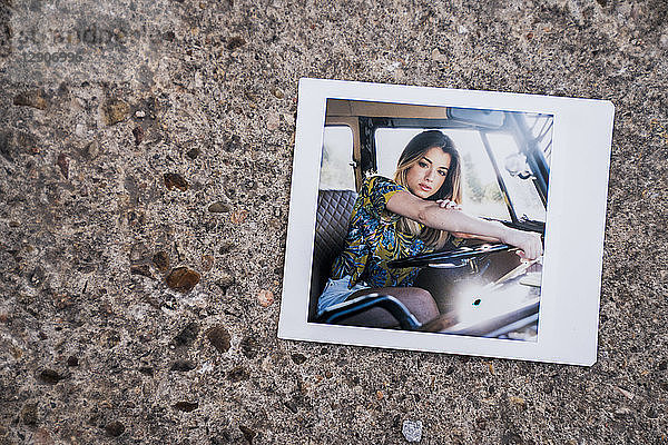 Instant photo of young woman in a van