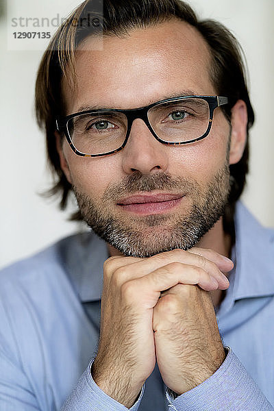 Portrait of confident man wearing glasses