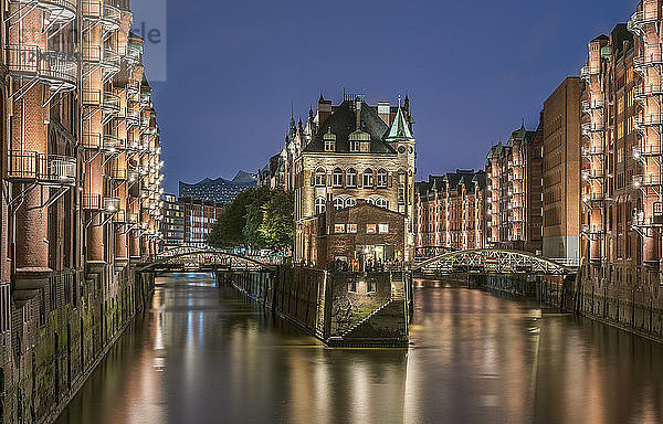 Germany  Hamburg  Speicherstadt  lighted old buildings with Elbe Philharmonic Hall in the background