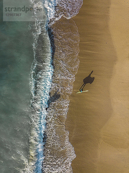 Indonesia  Bali  Aerial view of Pandawa beach  two surfers