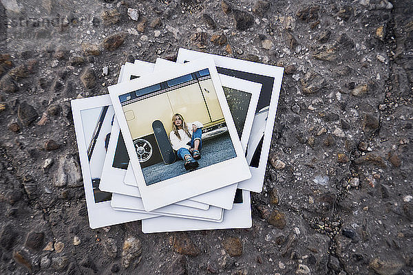 Instant photo of young woman with skateboard sitting at a vintage van