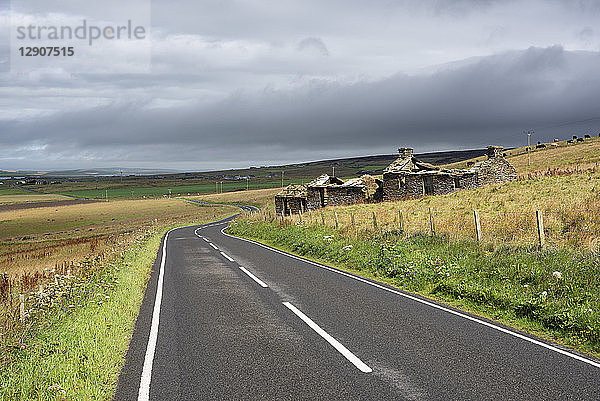 Great Britain  Scotland  Orkney  Mainland  old deserted and house at the road near Clowally