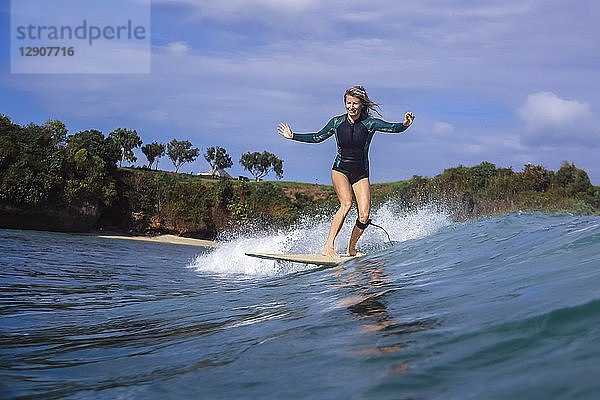 Indonesia  Bali  Balangan beach  surfer on a wave