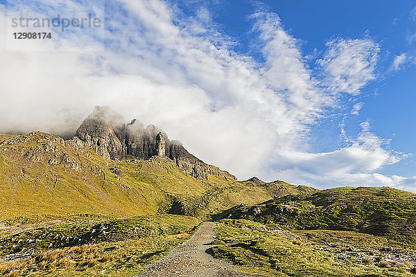 UK  Scotland  Inner Hebrides  Isle of Skye  Trotternish  clouds around The Storr  trail towards observation point