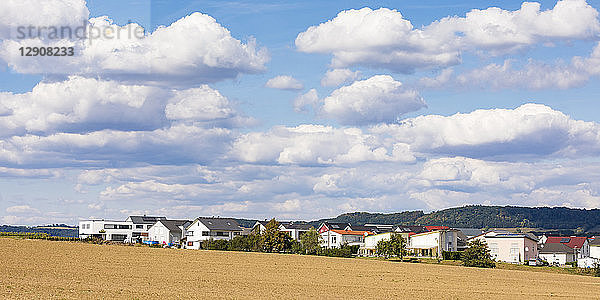 Germany  Baden-Wuerttemberg  Suessen  panoramic view of field and modern houses