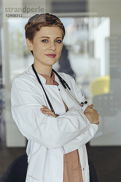 Portrait of a confident female doctor  with arms crossed