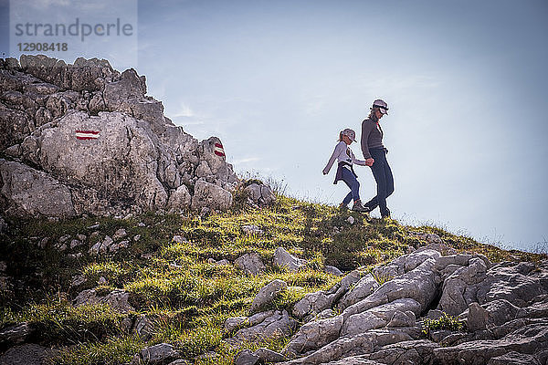 Austria  Salzburg State  Loferer Steinberge  mother and daughter on a hiking trip in the mountains