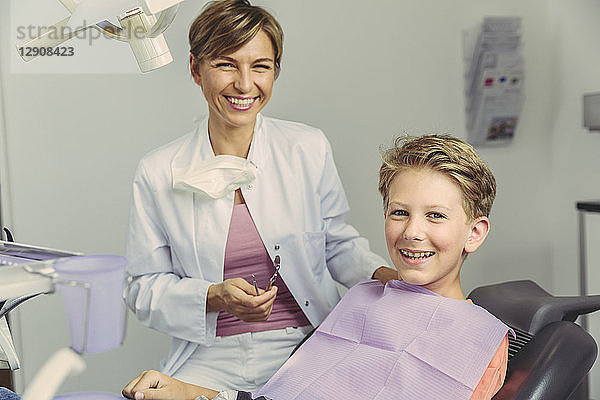 Boy smiling happily after treatment at the dentist
