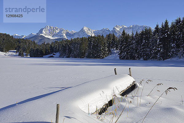 Germany  Werdenfelser Land  Kruen  view to Karwendel mountains and frozen snow-covered Lake Geroldsee