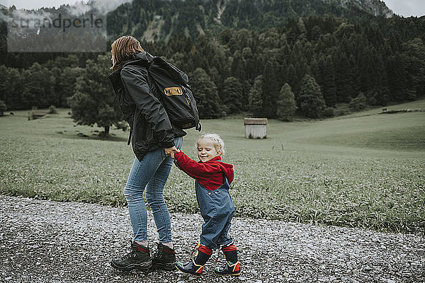 Austria  Vorarlberg  Mellau  mother and toddler on a trip in the mountains