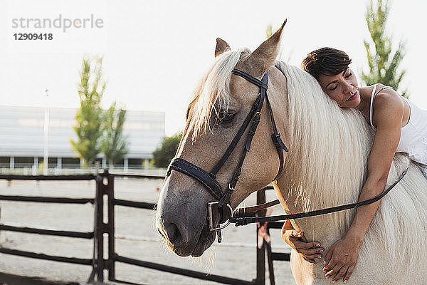 Portrait of woman relaxing on riding horse