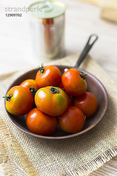 Fresh tomatoes in pan
