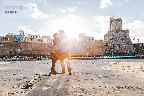 Italy  Molise  Termoli  young couple in the beach at sunrise