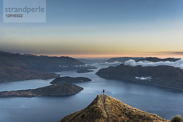 New Zealand  South Island  Wanaka  Otago  Woman on Coromandel peak at sunrise