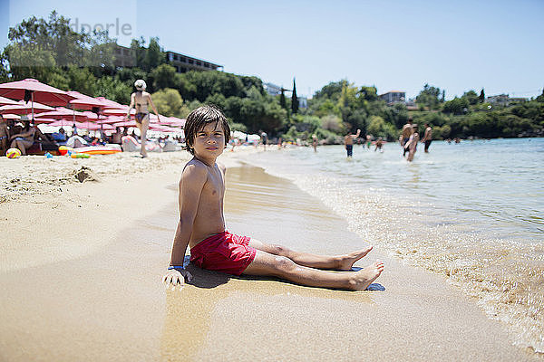 Portrait of a boy sitting on the beach