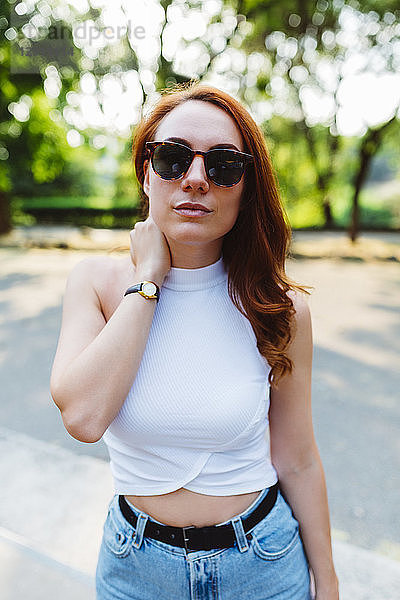 Portrait of redheaded woman wearing sunglasses