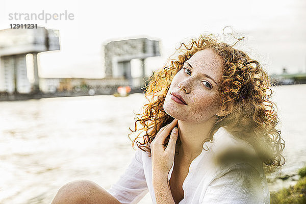 Germany  Cologne  portrait of freckled young woman with curly red hair
