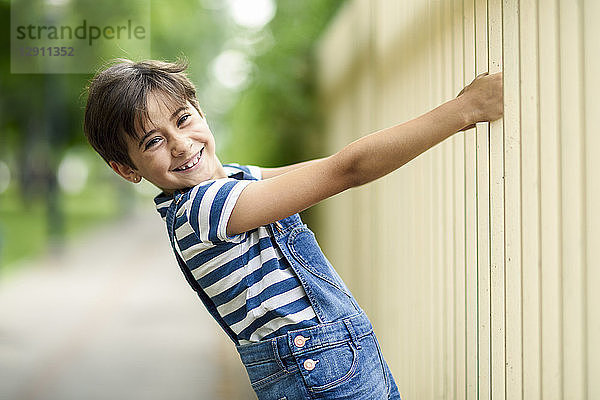 Portrait of smiling little girl playing outdoors