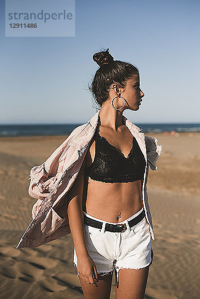 Fashionable teenage girl on the beach