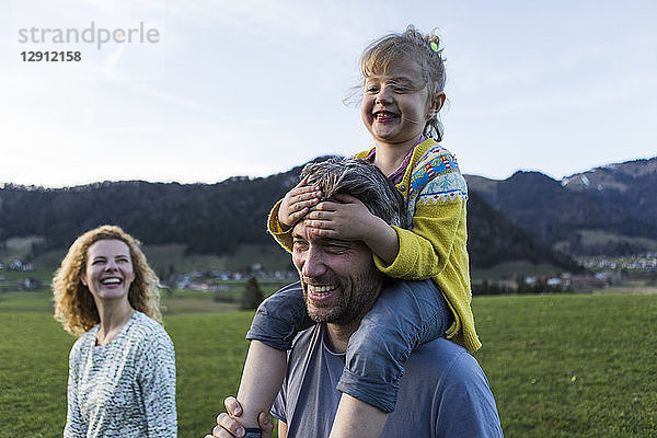 Austria  Tyrol  Walchsee  happy family hiking on an alpine meadow