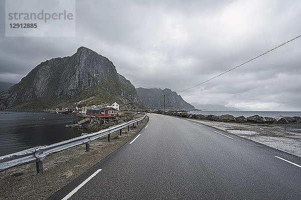 Norway  Lofoten  remote houses at the coast by the roadside