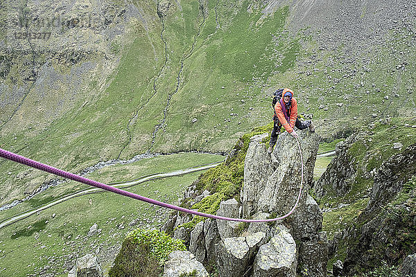 UK  Lake District  Longsleddale valley  Buckbarrow Crag  man climbing on rock