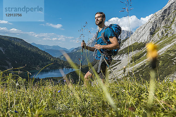 Austria  Tyrol  Young man hiking in the maountains at Lake Seebensee