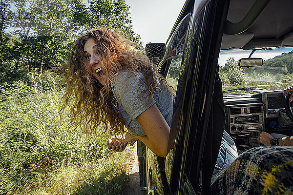 Young woman looking out of car window