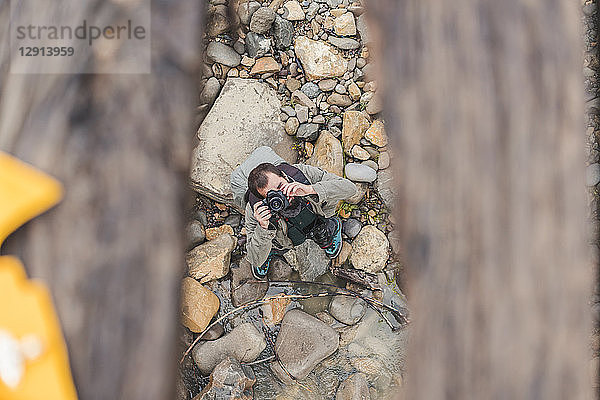 Man taking photo with camera outdoors  top view