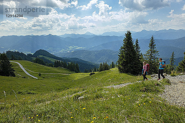 Germany  Bavaria  Brauneck near Lenggries  young couple hiking in alpine landscape