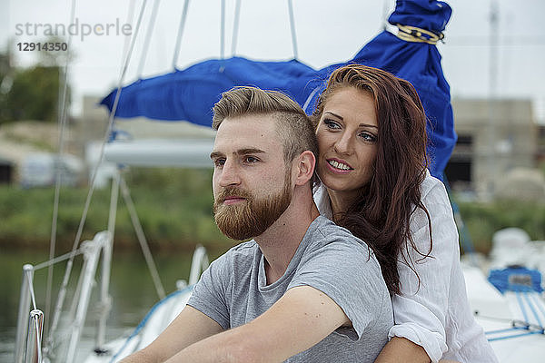 Portrait of a happy couple on a sailing boat
