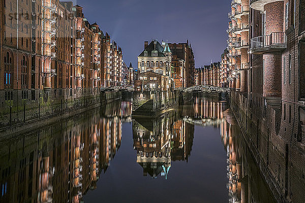 Germany  Hamburg  Speicherstadt  lighted old buildings with Elbe Philharmonic Hall in the background
