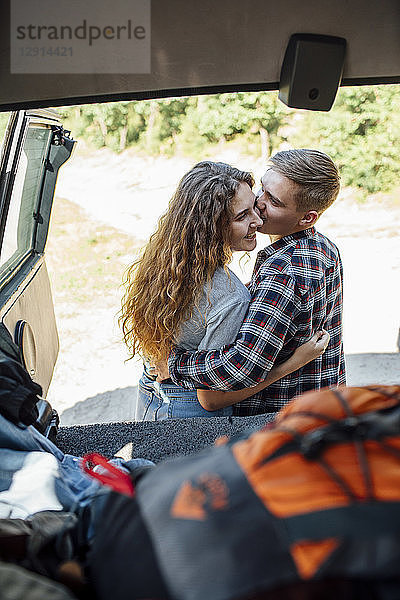 Romantic couple doing road trip  kissing