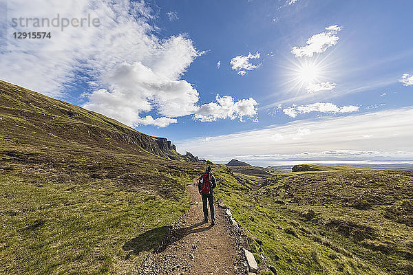 UK  Scotland  Inner Hebrides  Isle of Skye  Trotternish  Quiraing  tourist on hiking trail