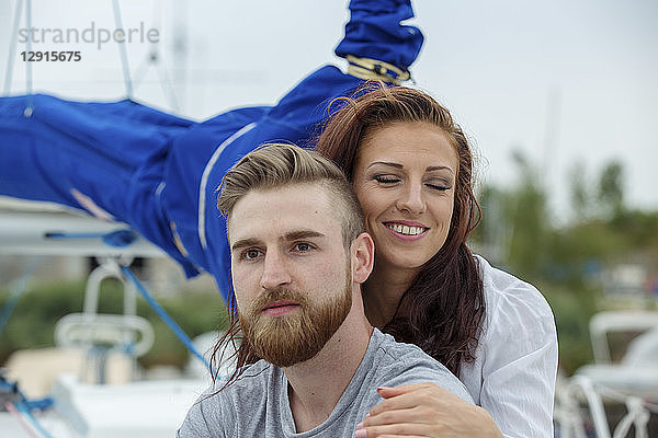 Portrait of a happy couple on a sailing boat