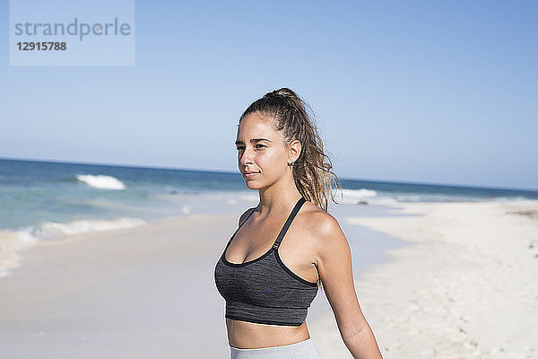 Spain  Canary Islands  Fuerteventura  young female athlete on the beach