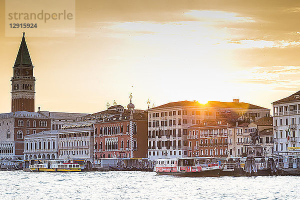 Italy  Venice  view from the lagoon towards St Mark's Square with Campanile at sunset