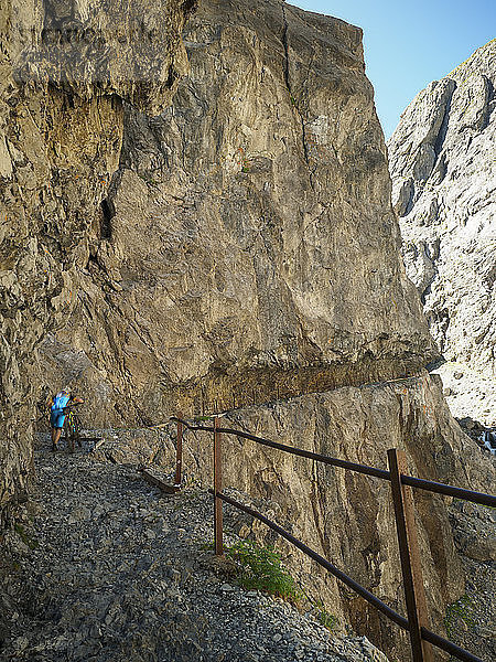 Switzerland  Lower Engadin  mountainbiker on path towards Uina gorge