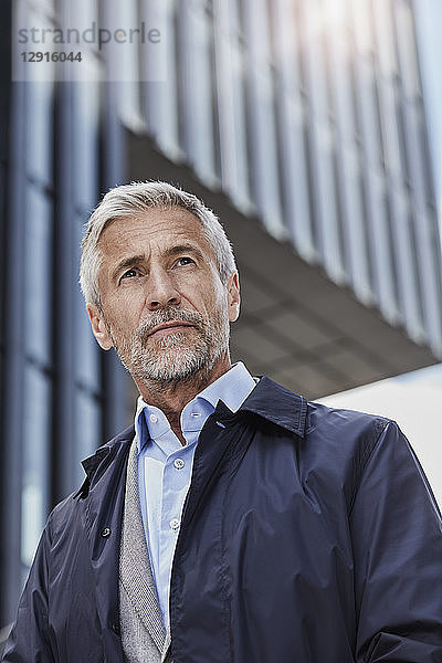 Portrait of pensive businessman outdoors