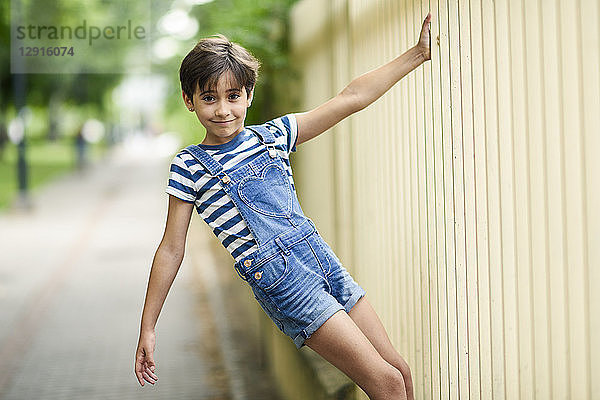 Portrait of smiling little girl playing outdoors